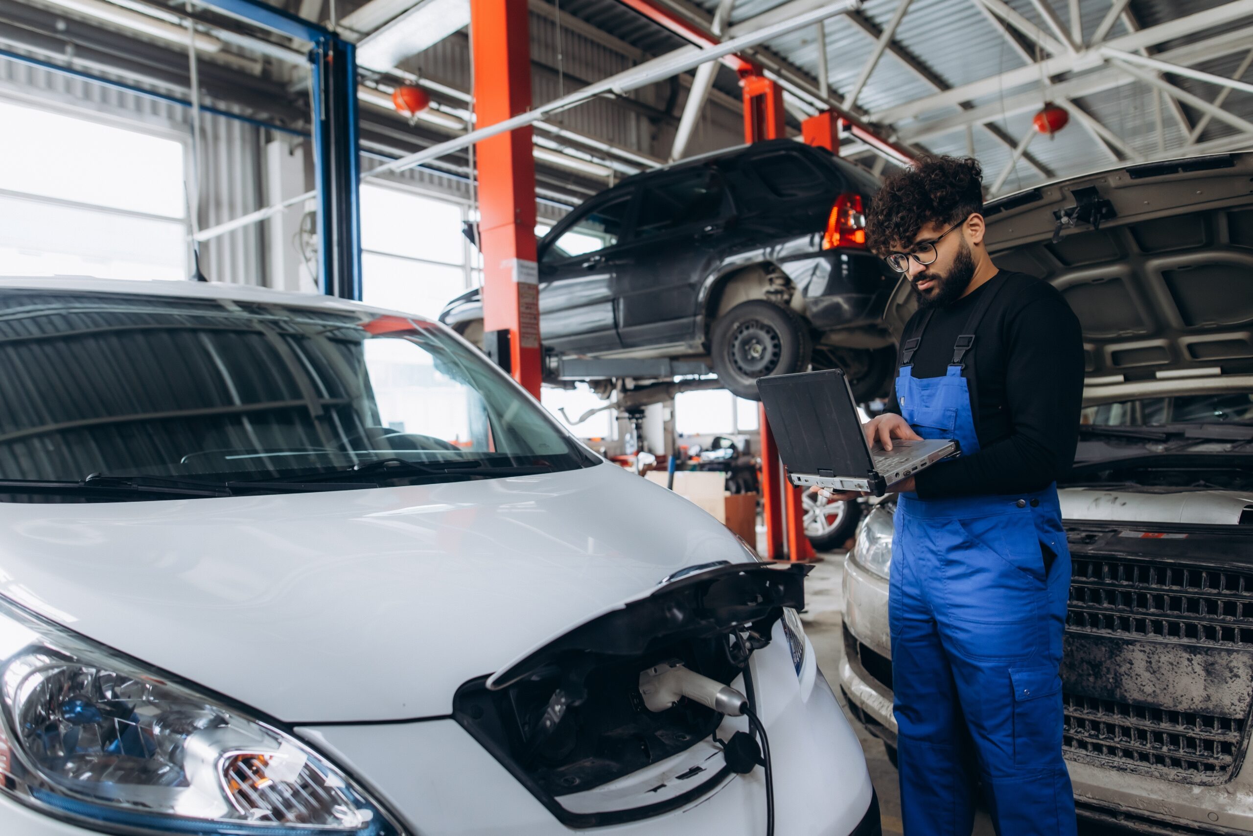 Technician diagnosing an electric vehicle battery system